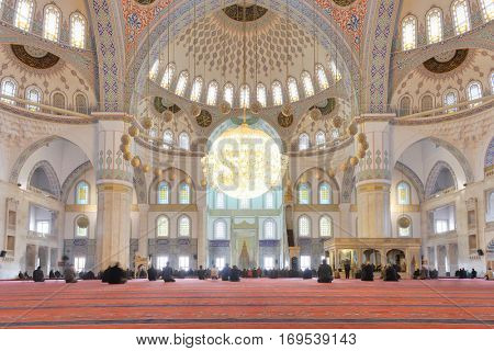 Ankara, Turkey - March 28, 2013: Kocatepe mosque interior view during prayer.  It is the largest mosque in Ankara and was built between 1967 and 1987.