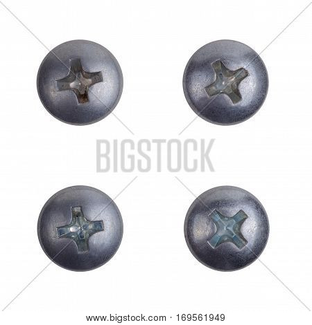 Four heads of screws on a white background. Top view