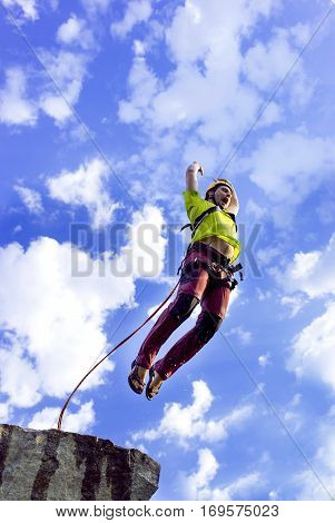 The first jump off the cliff with a safety rope.