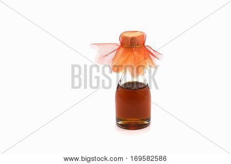Small bottle of honey isolated on white background