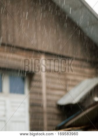 COLOR PHOTO OF BLURRY SHOT OF RAINDROPS