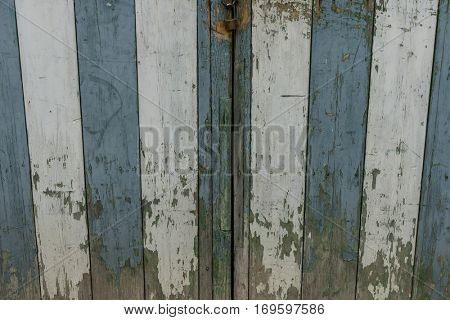 Old and worn wooden door in the town of Valldemosa in the Balearic Islands Spain