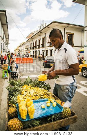 popayan, colombia - November, 27th, 2015 - fruit seller in white city popayan colombia south america