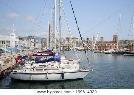 Many boats moored at Marina Porto Antico in Genoa, Italy at summer day