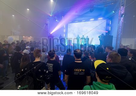 Moscow, Russia - December 9, 2016: People attend rap battle at Vapexpo Moscow 2016 exhibition which presents new modern vape gadgets, liquids and flawours