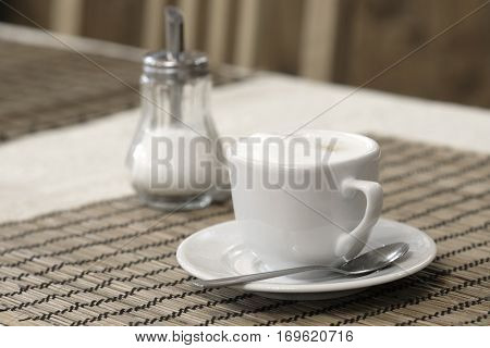 Cup of a coffee on a table