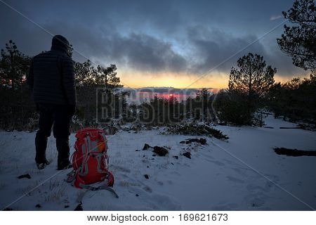 man looking at last sunset of the year 2016 in winter Etna Park, Sicily 