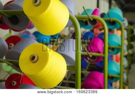 Spools of thread in the sewing equipment. The concept of sewing and textile production.