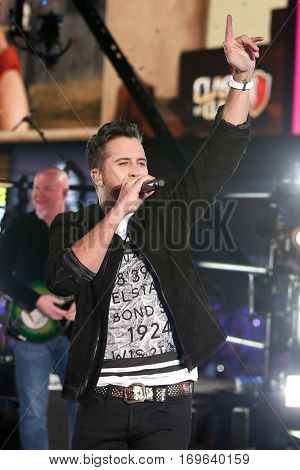 NEW YORK-DEC 31: Recording artist Luke Bryan performs during Dick Clark's New Year's Rockin' Eve at Times Square on December 31, 2015 in New York City.