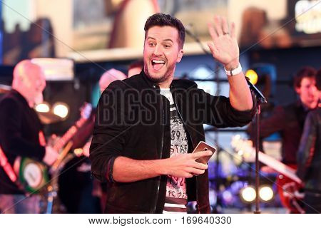 NEW YORK-DEC 31: Recording artist Luke Bryan performs during Dick Clark's New Year's Rockin' Eve at Times Square on December 31, 2015 in New York City.