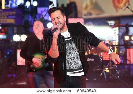NEW YORK-DEC 31: Recording artist Luke Bryan performs during Dick Clark's New Year's Rockin' Eve at Times Square on December 31, 2015 in New York City.