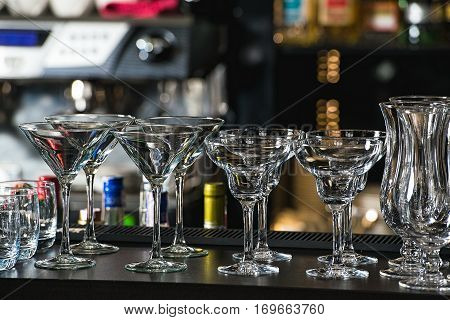 Glasses For A Margarita, Martini, Grog And Liqueur On A Bar At R
