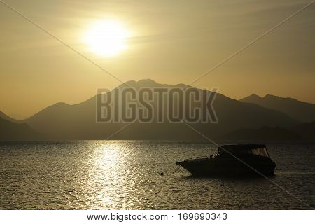 Scenic sunrise over the mountainous coast of the Mediterranean sea.