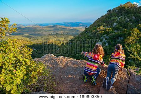 Family travel with children, kids looking from mountain viewpoint, holiday vacation in South Africa