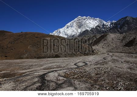 Mount Nuptse and creek Everest National Park Nepal.