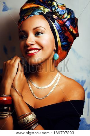 beauty bright african woman with creative make up, shawl on head like cubian  closeup