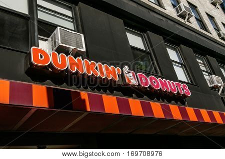 New York, February 6, 2017: Dunkin Donuts sign above one of their numerous locations in Manhattan.
