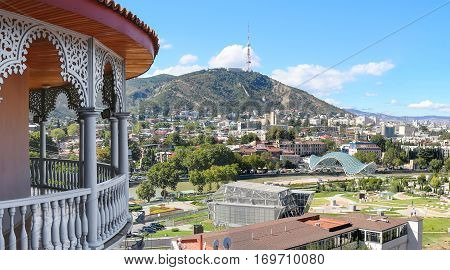 Panoramic view of Tbilisi Georgia with Bridge of Peace and Rike Park from the carved balcony