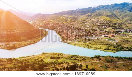 The picturesque landscape with the confluence of the rivers Kura and Aragvi (Mtskheta) in Georgia under the sun