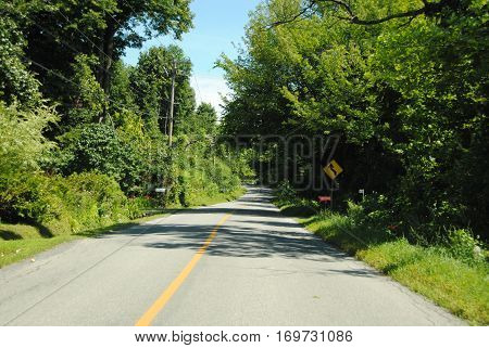Rural road near Hudson, Quebec on a warm summer day