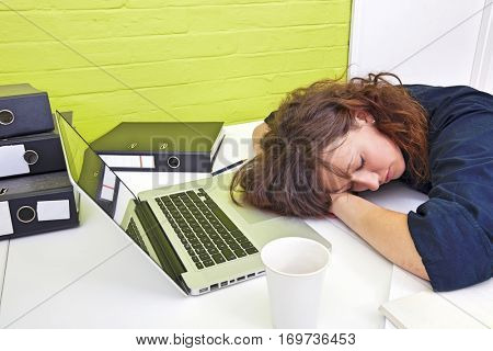 Woman asleep at her desk