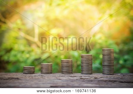 Stack of coins growing up for business investment or saving concept