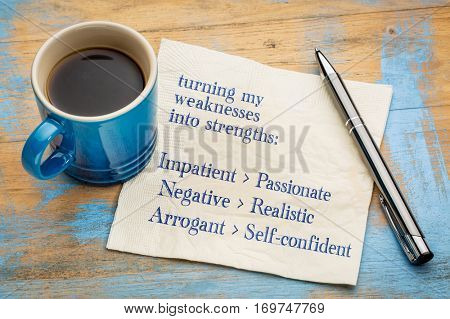 turning my weakness into strengths concept -handwriting on a napkin with a cup of espresso coffee