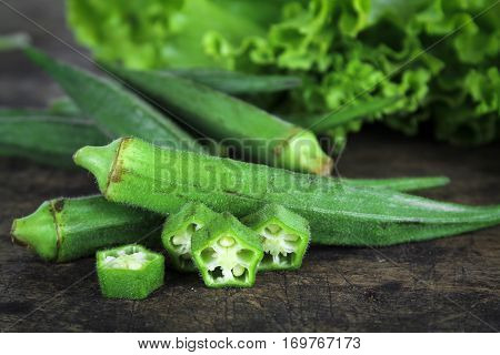 fresh whole and slice organic green okra, healthy vegetable