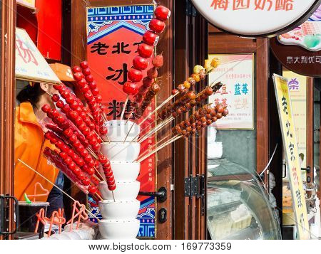 Beijing, China - March 26, 2015: Candied Fruit On Sticks Being Sold On The Streets In Old Downtown B