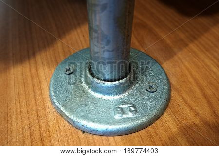 screw lock bar to the wood floor