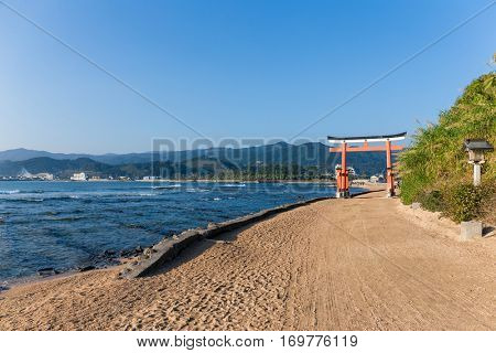 Aoshima Island and japanese torii with sunshine