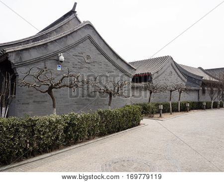 Atmospheric Street With Renovated Grey Brick Houses In Old Hutong District Of Central Beijing