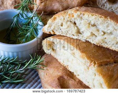 Homemade sliced ciabatta bread with fresh rosemary