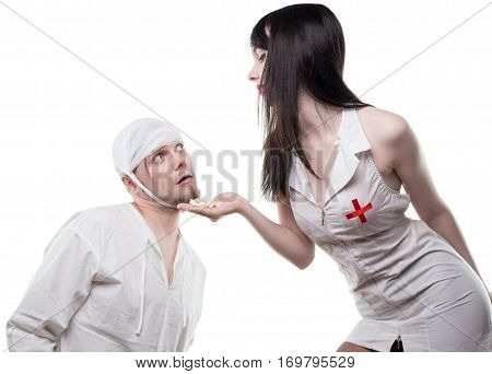 Nurse offers analgetic drugs on white background