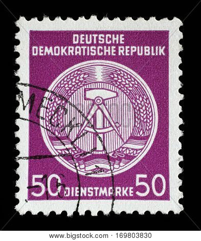 ZAGREB, CROATIA - SEPTEMBER 05: A Stamp printed in GDR (East Germany) shows DDR national coat of arms with inscription Service Stamp, circa 1952, on September 05, 2014