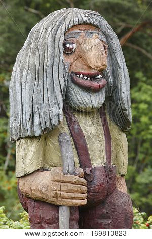 Norwegian carved wooden face detail troll. Scandinavian folklore. Norway. Vertical