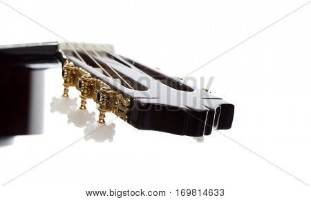 Close up of a classical guitar's tuning pegs with space for your text.