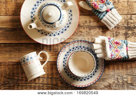 Set of dinnerware on wooden table, top view