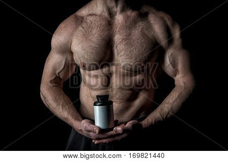 Handsome Sexy Athlete Man With Muscular Body Holds Plastic Jar Or Container