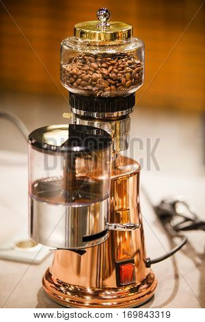 Small electric coffee machine. Kitchen household cooking appliance. Modern electronic coffeemaker, device for preparing coffee