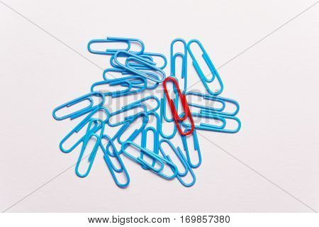 Undaunted red paperclip. Miscellaneous office supplies. Assortment of stationery.
