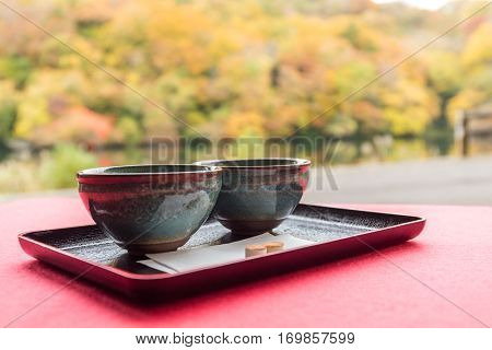 Japanese green tea with autumn background