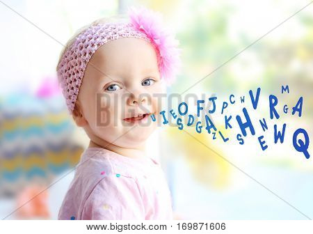 Little girl and alphabet letters on background. Speech therapy concept