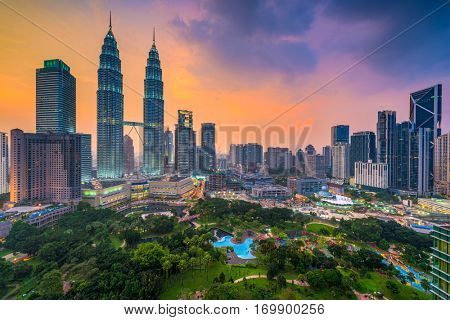 Kuala Lumpur, Malaysia skyline at dusk over the park.