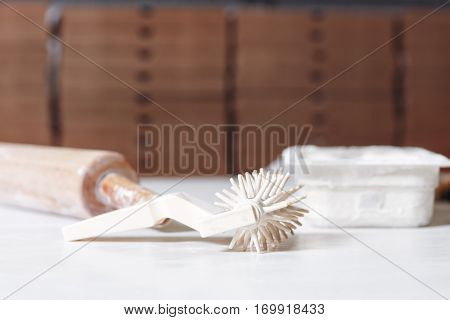 pizza coocking tools and utensils at wooden table.