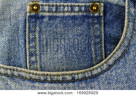 Front pocket of blue jeans denim texture background.