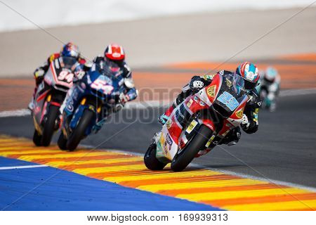 VALENCIA, SPAIN - NOV 13: 23 Schrotter, 54 Pasini, 94 Folger in Moto2 Race during Motogp Grand Prix of the Comunidad Valencia on November 13, 2016 in Valencia, Spain.