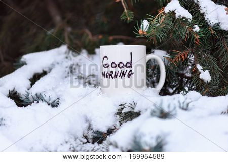 white cup with text or inscription 