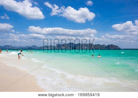CRABI PROVINCE THAILAND - FEBRUARY 02 2015: Tourists swimming in turquoise water of Andaman sea at Krabi province Thailand