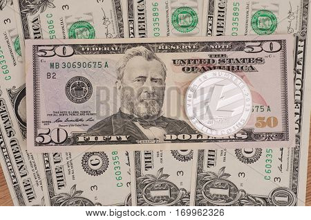 SARANSK, RUSSIA - FEBRUARY 5, 2017: Silver plated Litecoin on United States fifty-dollar billl.